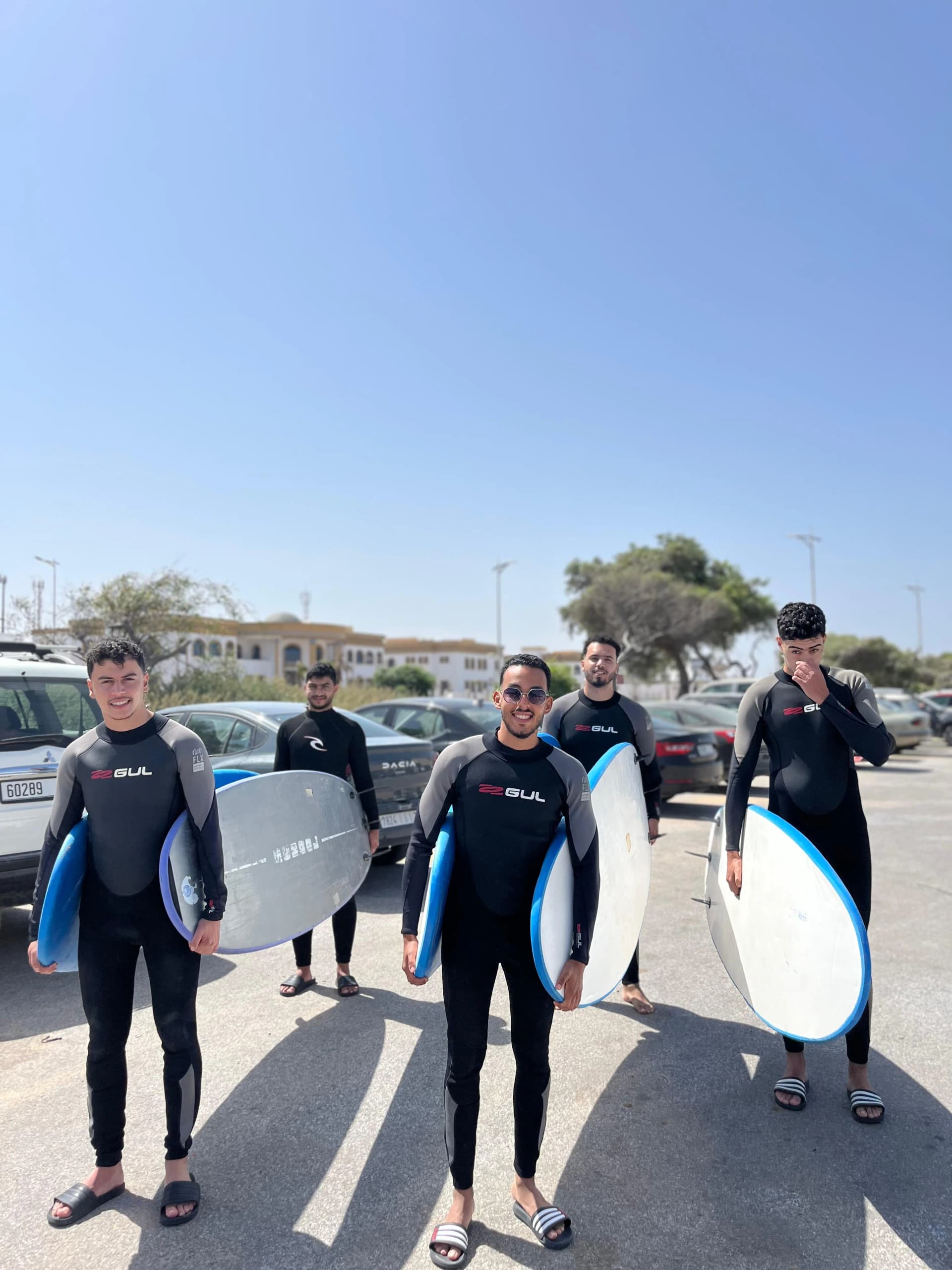 Surf Essaouira — learner with board, Atlantic surf camp vibe Morocco